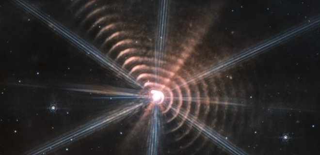 Вчені розкрили природу концентричних кілець навколо віддаленої зірки – вони містять пил - Фото